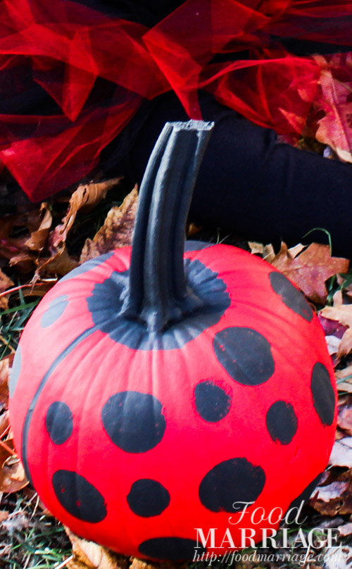Hand Painted Ladybug Pumpkin for Halloween with red and black acrylic paint. The perfect compliment to your little girl's costume or to your home decor. | FoodMarriage.com